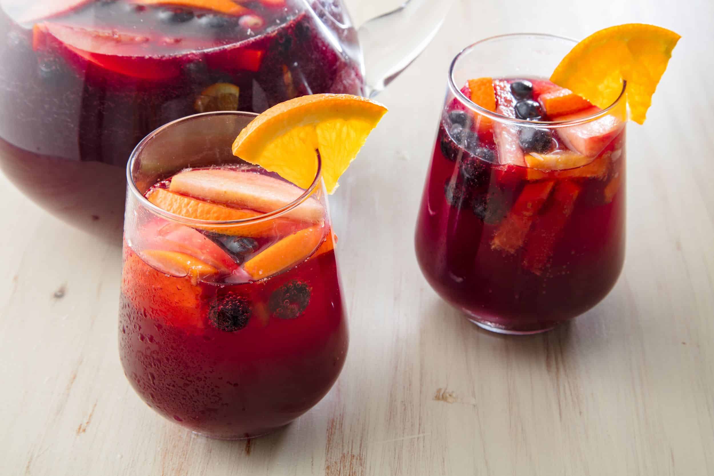 2 glasses of sangria cocktail with fruit inside
